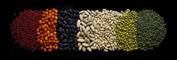 various legumes on a dark background. photo