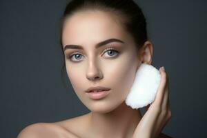 Young woman cleaning her face with cotton pad photo shot. Generate Ai