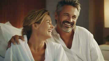 Middle-aged couple reading and smiling in bed. Generative AI photo