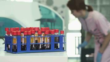 Blood samples in test tubes on the foreground copy space on the side video