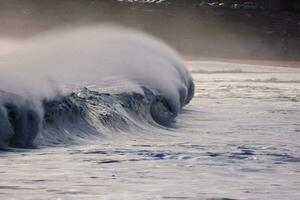 a large wave is crashing photo