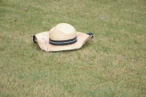 straw hat on a grass photo