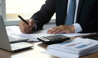Accountant working on desk using calculator to calculate financial report in office business accounting finance concept AI Generated photo