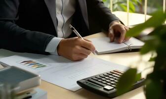 Accountant working on desk using calculator to calculate financial report in office business accounting finance concept AI Generated photo