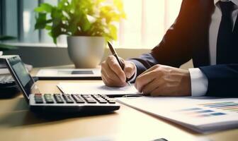 Accountant working on desk using calculator to calculate financial report in office business accounting finance concept AI Generated photo