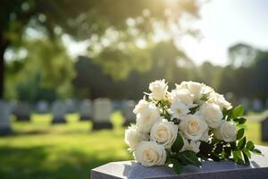 white flowers in front of a gravestone at a cemetery with sunset.Funeral Concept AI generated photo