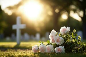 blanco flores en frente de un lápida sepulcral a un cementerio con atardecer.funeral concepto ai generado foto