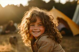 Portrait of cute little girl at camera while standing near camping tent at sunset AI generated photo