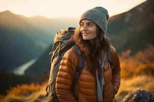 Beautiful woman hiker with backpack hiking in the mountains at sunset AI generated photo