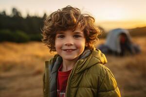 Portrait of a cute boy looking at camera while near his tent in nature AI generated photo