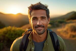 Portrait of man looking at camera while near camping tent at sunset AI generated photo