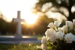 white flowers in front of a gravestone at a cemetery with sunset.Funeral Concept AI generated photo