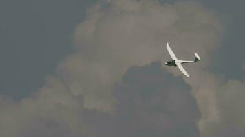 Glider is landing on a small airfield. Nonmotorized aircraft. Glider against green forest video