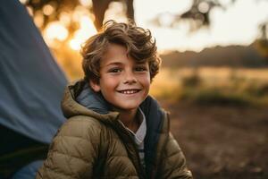 Portrait of a cute boy looking at camera while near his tent in nature AI generated photo