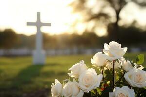 white flowers in front of a gravestone at a cemetery with sunset.Funeral Concept AI generated photo