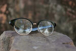 Glasses on blur background photo