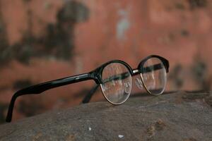 Glasses on blur background photo