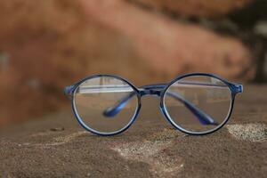 Glasses on blur background photo