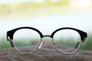 Glasses on blur background photo