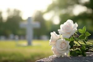 blanco flores en frente de un lápida sepulcral a un cementerio con atardecer.funeral concepto ai generado foto