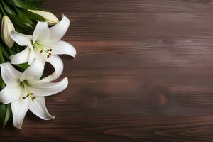 White lily flowers on wooden background. Top view with copy space.Funeral Concept AI generated photo