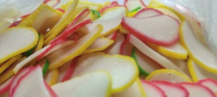 multicolor uncooked raw crackers kerupuk warna warni Indonesian traditional food isolated white background selective focus photo