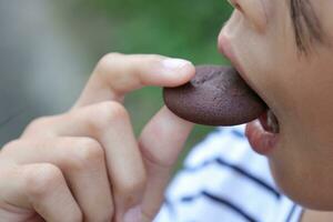 Close-up view of mouth eating food photo
