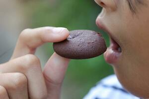 Close-up view of mouth eating food photo