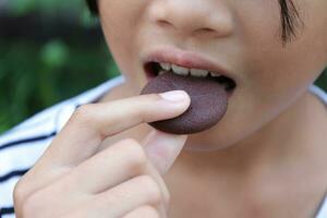 Close-up view of mouth eating food photo