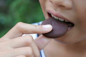 Close-up view of mouth eating food photo