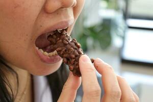 Close-up view of mouth eating food photo