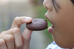 Close-up view of mouth eating food photo