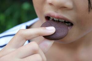 Close-up view of mouth eating food photo