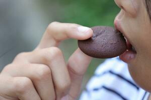 Close-up view of mouth eating food photo