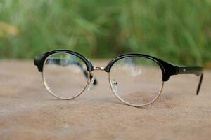 Glasses on blur background photo