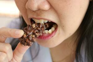 Close-up view of mouth eating food photo