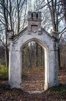 Ancient stronghold entrance ruin concept photo. Parkland overlooking from the yard. photo