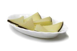 Pieces of cheeses served on a plate, isolated on white background. Concept of the best cheeses. photo