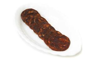 Iberian chorizo, isolated on white background. Spanish delicatessen concept. photo