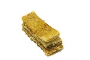 A delicious piece of fruit millefeuille cake. Isolated on white background. photo