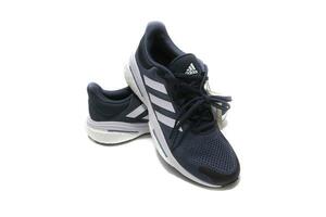 Huelva, Spain, 2.20.2023,Adidas Solar Glide 5, surely the best running shoes, quality  price. Isolated on a white background. photo