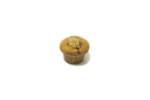 Muffins with chocolate flecks isolated on a white background. Muffins are made mainly from wheat flour, egg, vegetable oil, cow's milk, baking powder, essence ,vanilla being the most common, and sugar photo