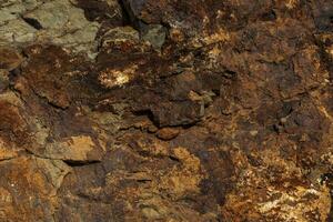 Background of a stone and metal texture. The perfect combination of strength and elegance. photo