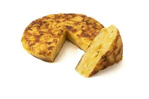 Spanish omelette or potato omelette, isolated on white background. Tortilla de patatas is a delicious Spanish dish made with eggs and potatoes, typically served as a tasty omelette or potato cake. photo
