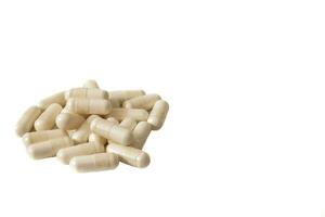 A bunch of magnesium citrate capsules. Isolated on white background. A dietary supplement that provides a highly absorbable form of magnesium and may be beneficial for bone and muscle health. photo