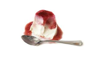 Panna cotta with strawberry sauce, isolated on a white background. Italian food concept. photo