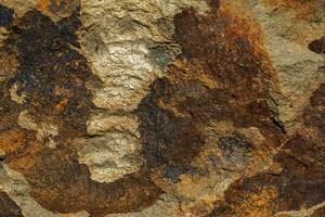 Background of a stone and metal texture. The perfect combination of strength and elegance. photo