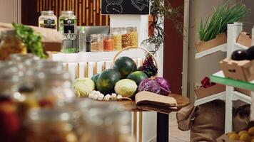 Low carbon footprint zero waste supermarket with ethically sourced fruits, vegetables, grains, spices and pasta on display. Empty eco friendly local neighborhood grocery store video