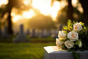 white flowers in front of a gravestone at a cemetery with sunset.Funeral Concept AI generated photo