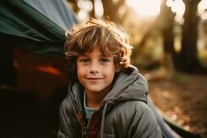 Portrait of a cute boy looking at camera while near his tent in nature AI generated photo